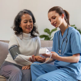 nurse checking up elderly woman