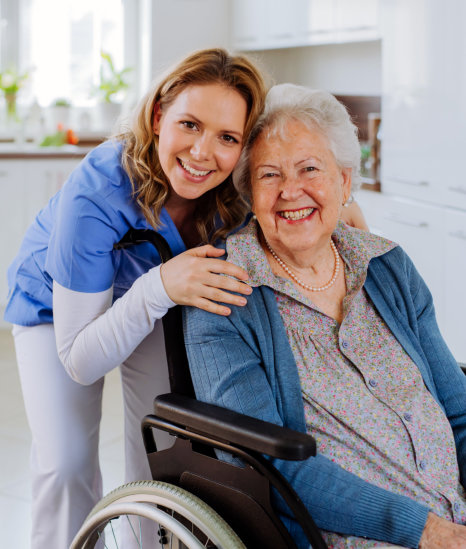 nurse and elderly woman smiling