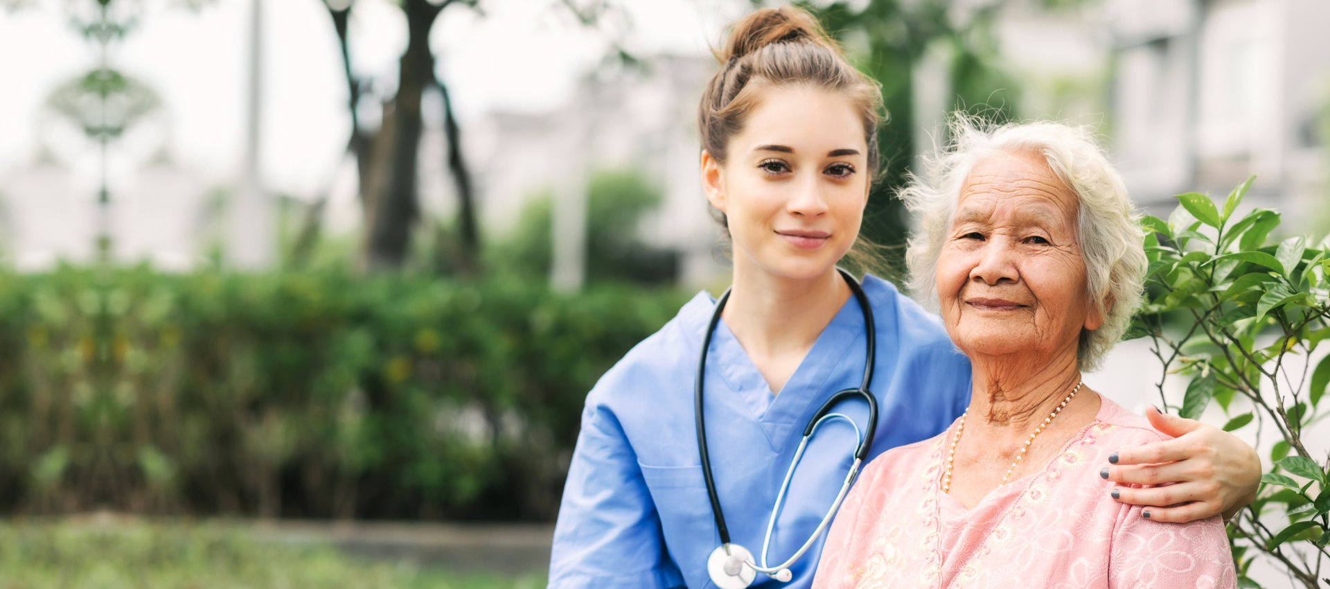 nurse and elderly woman sitting