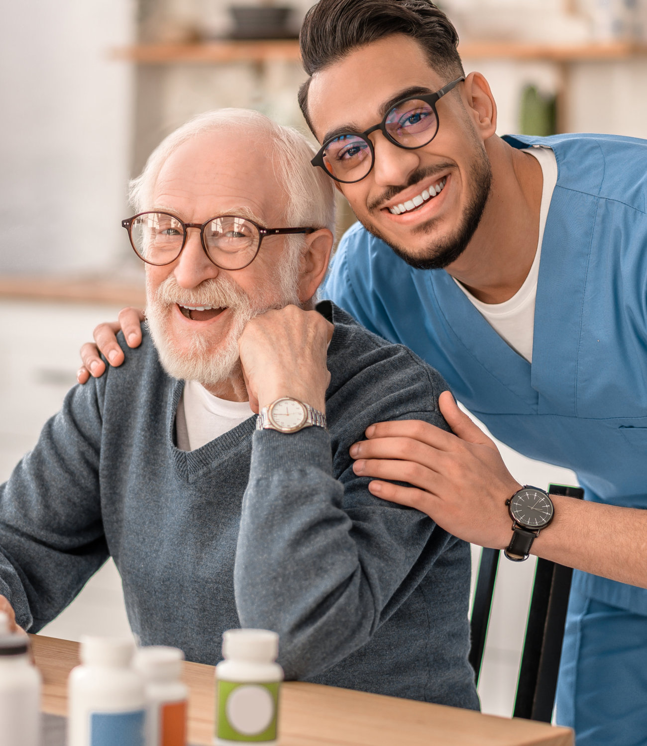 nurse hugging elderly man