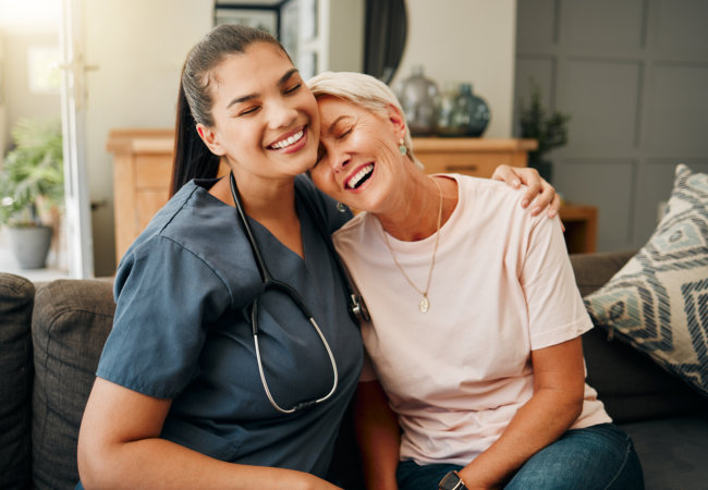 nurse and elderly woman smiling