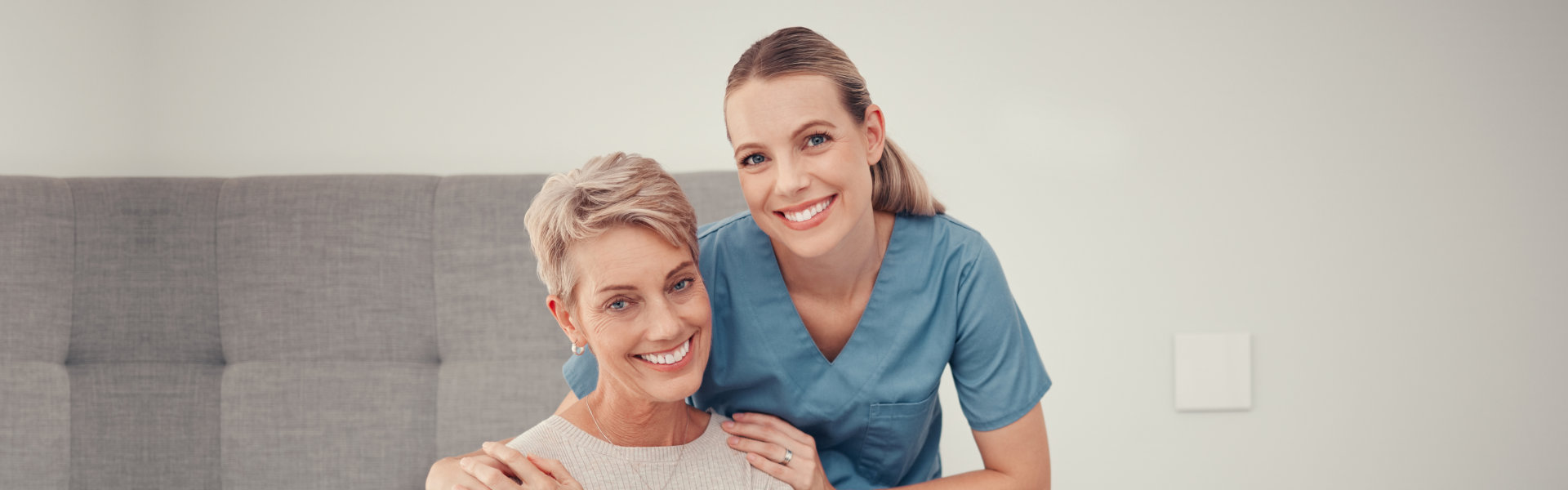 nurse and woman smiling