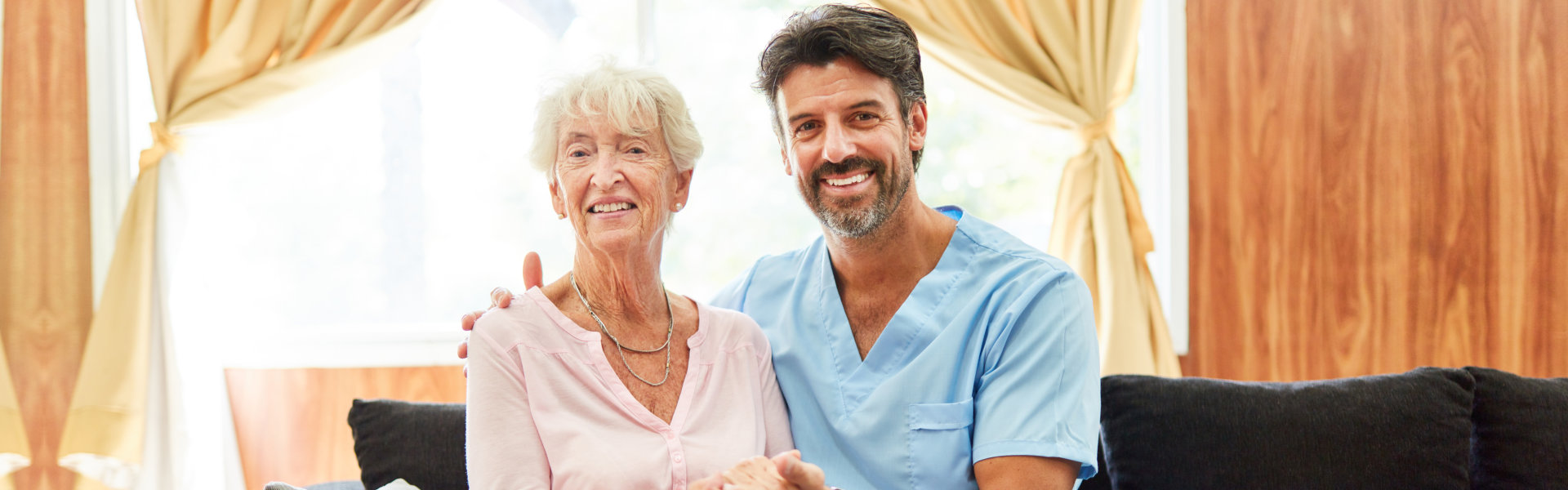 elderly and nurse smiling