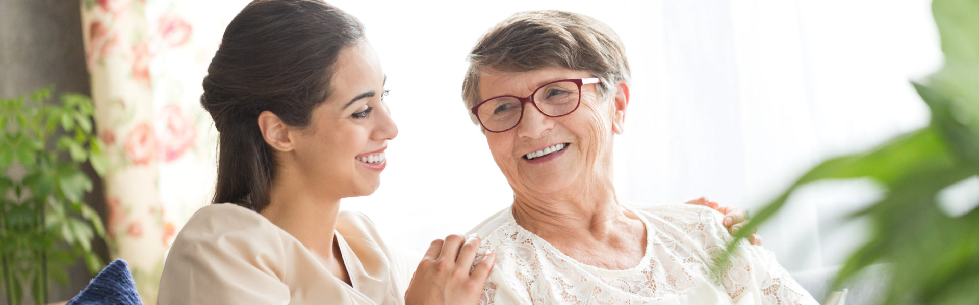 nurse and elderly woman smiling